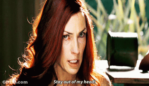A Woman With Red Hair Is Saying Stay Out Of My Head . GIF