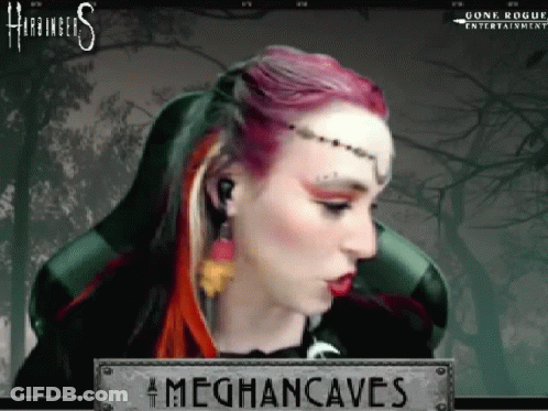 A Woman With Red Hair Is Sitting In A Chair With A Sign That Says Meghancaves On It . GIF