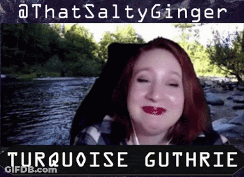 A Woman With Red Hair Is Smiling In Front Of A River And The Words That Salty Ginger Turquoise Guthrie GIF