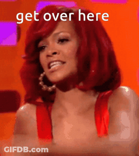 A Woman With Red Hair Is Smiling With The Words Get Over Here Behind Her GIF