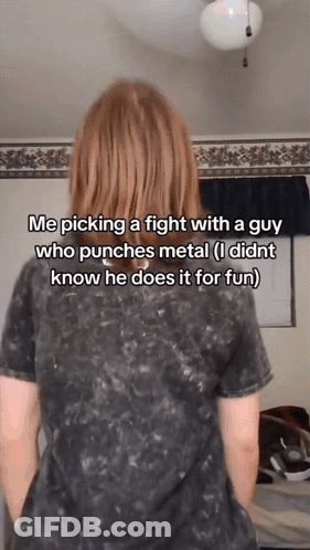 A Woman With Red Hair Is Standing In Front Of A Wall With A Caption That Says Me Picking A Fight GIF