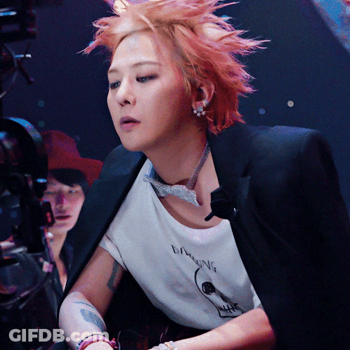A Woman With Red Hair Is Wearing A T-Shirt That Says Laughing On It GIF