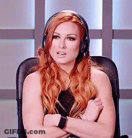 A Woman With Red Hair Is Wearing Headphones And Sitting In A Chair GIF
