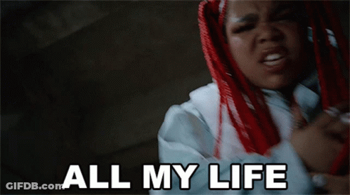 A Woman With Red Hair Says " All My Life " In White Letters GIF
