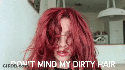 A Woman With Red Hair Says Do N't Mind My Dirty Hair . GIF