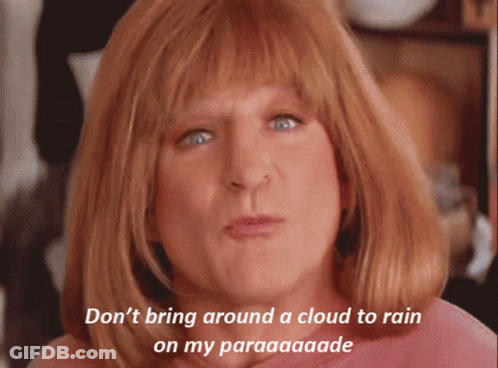 A Woman With Red Hair Says " Don T Bring Around A Cloud To Rain On My Paraaaaade " GIF