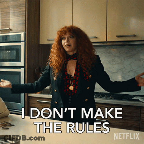 A Woman With Red Hair Says I Don 'T Make The Rules GIF