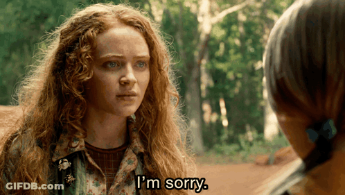 A Woman With Red Hair Says I 'M Sorry In Front Of Another Woman GIF