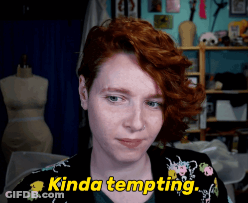 A Woman With Red Hair Says " Kinda Tempting " In Yellow Letters GIF