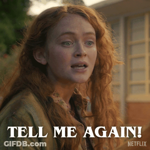 A Woman With Red Hair Says Tell Me Again On A Netflix Advertisement GIF