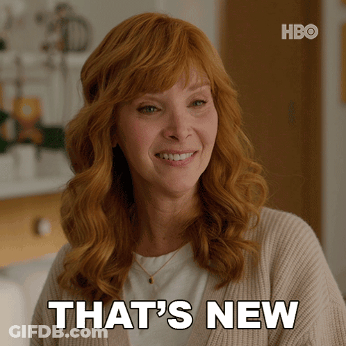 A Woman With Red Hair Says That 'S New In Front Of A Hbo Logo GIF