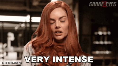 A Woman With Red Hair Says Very Intense In A Snake Eyes Ad GIF