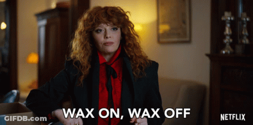 A Woman With Red Hair Says Wax On Wax Off In A Netflix Ad GIF