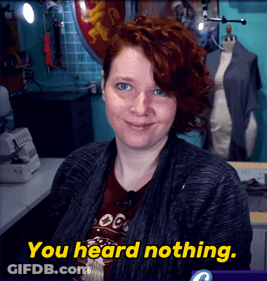 A Woman With Red Hair Says " You Heard Nothing " In Yellow Letters GIF