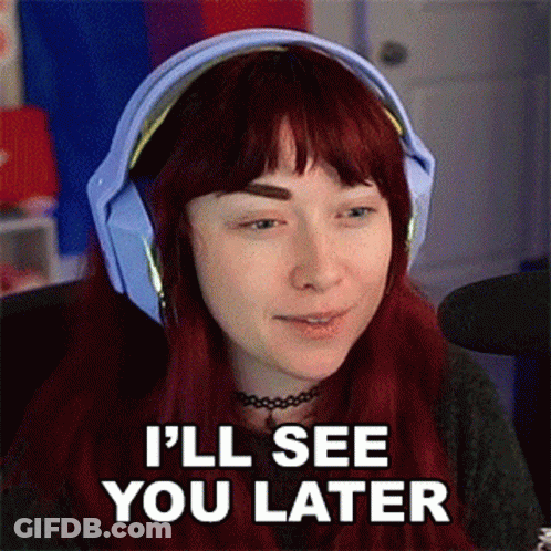 A Woman With Red Hair Wearing Headphones Says I 'Ll See You Later . GIF