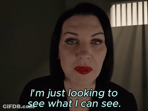 A Woman With Red Lips Is Looking To See What I Can See GIF