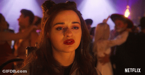 A Woman With Red Lips Is Standing In Front Of A Purple Background With The Word Netflix On It GIF