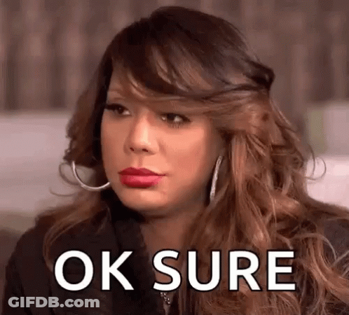 A Woman With Red Lipstick And Hoop Earrings Is Making A Funny Face And Saying Ok Sure . GIF