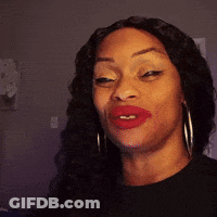 A Woman With Red Lipstick And Hoop Earrings Is Making A Funny Face . GIF