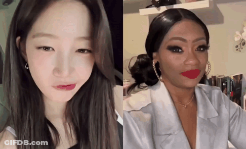 A Woman With Red Lipstick Looks At The Camera GIF