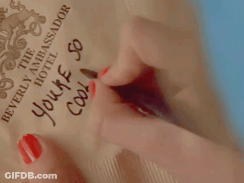 A Woman With Red Nails Writes " You 'Re So Cool " GIF