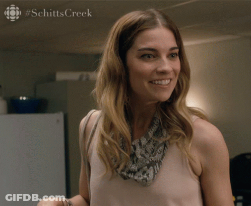 Woman With Schittscreek Text At Bottom GIF