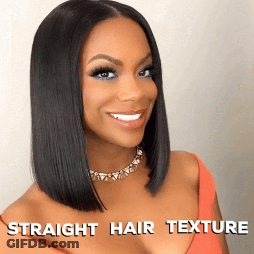 A Woman With Straight Hair Texture Is Smiling And Wearing An Orange Top GIF