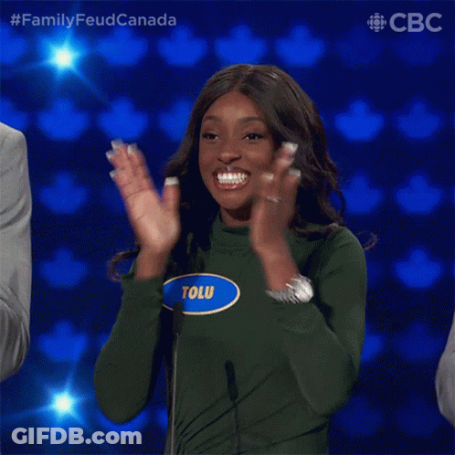 A Woman With The Name Tolu On Her Shirt Is Clapping GIF