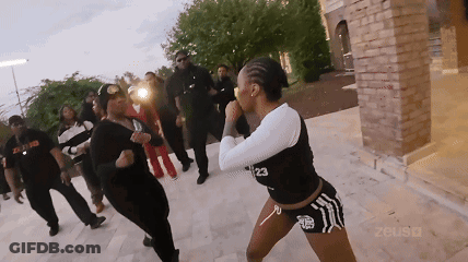 A Woman With The Number 23 On Her Top GIF