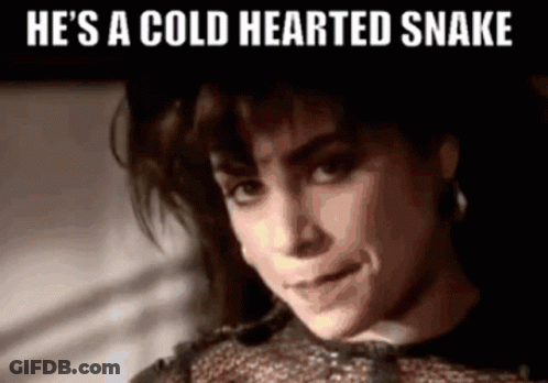 A Woman With The Words He 'S A Cold Hearted Snake Written Above Her GIF