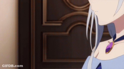 A Woman With White Hair And A Purple Necklace Stands In Front Of A Door GIF