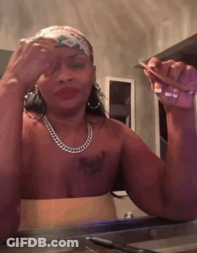 A Woman Without A Shirt Is Holding A Piece Of Paper In Her Hand GIF
