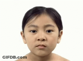 A Woman Without A Shirt Is Looking At The Camera GIF