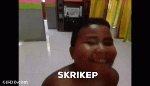 A Woman Without A Shirt Is Smiling And The Word Skrikep Is On The Bottom Of Her Face . GIF