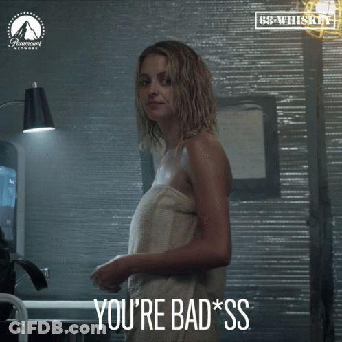 A Woman Wrapped In A Towel With The Words You 'Re Bad Ss Below Her GIF