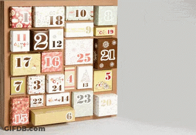A Wooden Advent Calendar With Boxes Labeled With The Numbers 1 Through 20 GIF