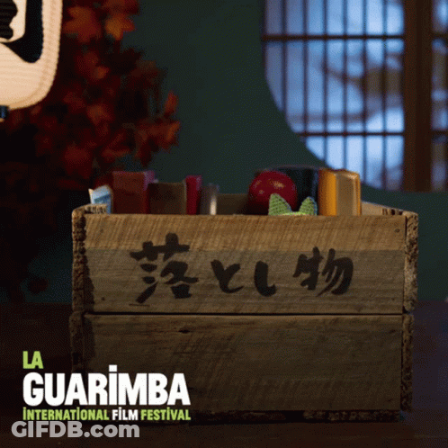 A Wooden Box With Chinese Writing On It And The Words La Guarimba International Film Festival GIF