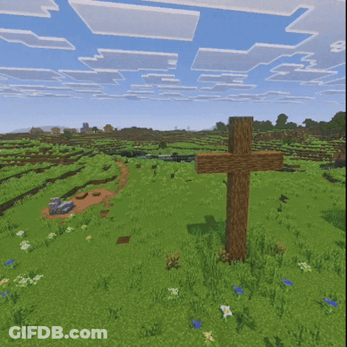 A Wooden Cross In The Middle Of A Field GIF
