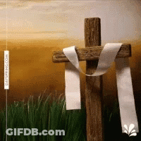 A Wooden Cross With A White Ribbon On It GIF