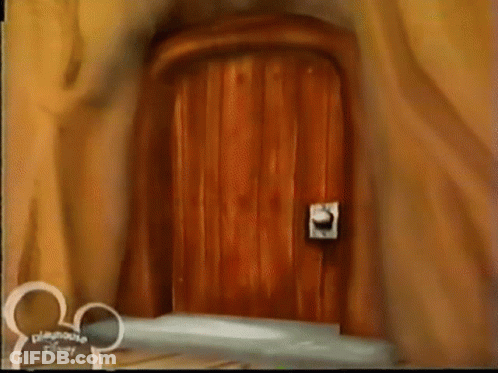 A Wooden Door With A Disney Logo On The Bottom GIF