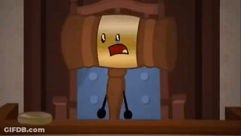 A Wooden Judge 'S Gavel With A Crying Face Is Sitting At A Table . GIF
