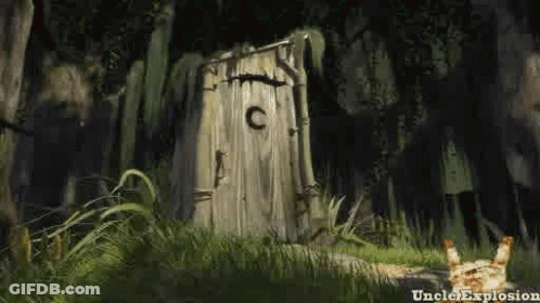 A Wooden Outhouse In The Middle Of A Forest With A Cat Standing In Front Of It . GIF