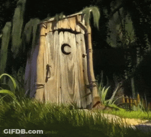 A Wooden Outhouse With A C On The Door GIF