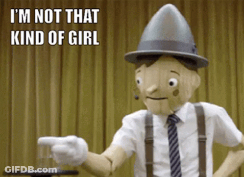 A Wooden Puppet Says I 'M Not That Kind Of Girl While Pointing A Gun GIF