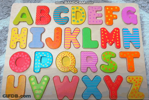 A Wooden Puzzle With The Letters Abcdefghijklmn Opqrst And Uvwxyz On It GIF
