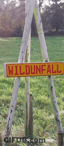 A Wooden Sign That Says Wildunfall On It GIF