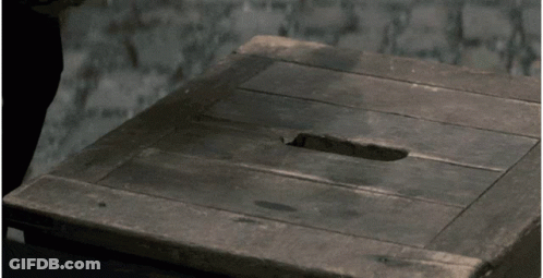 A Wooden Table With A Hole In The Middle GIF