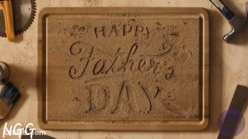 A Wooden Tray With The Words Happy Father 'S Day Written On It GIF