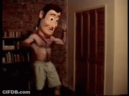 A Woody Doll Is Standing In A Room With His Shirt Off . GIF