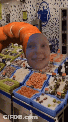 A Worm With A Face On It Is In A Seafood Market GIF